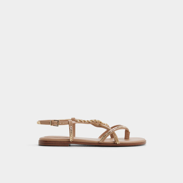 Beige sandal with thin straps on a light gray background