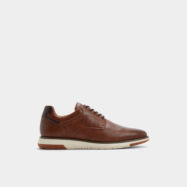 Brown leather shoe on a light gray background