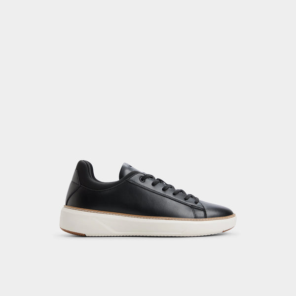 Black leather sneaker on a light gray background